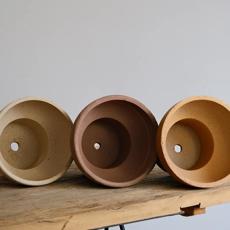 Nipots Terracotta Clay Pot - Detailed View of Drainage Hole Design for Optimal Plant Health