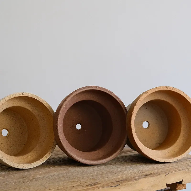 Nipots Terracotta Clay Pot - Detailed View of Drainage Hole Design for Optimal Plant Health